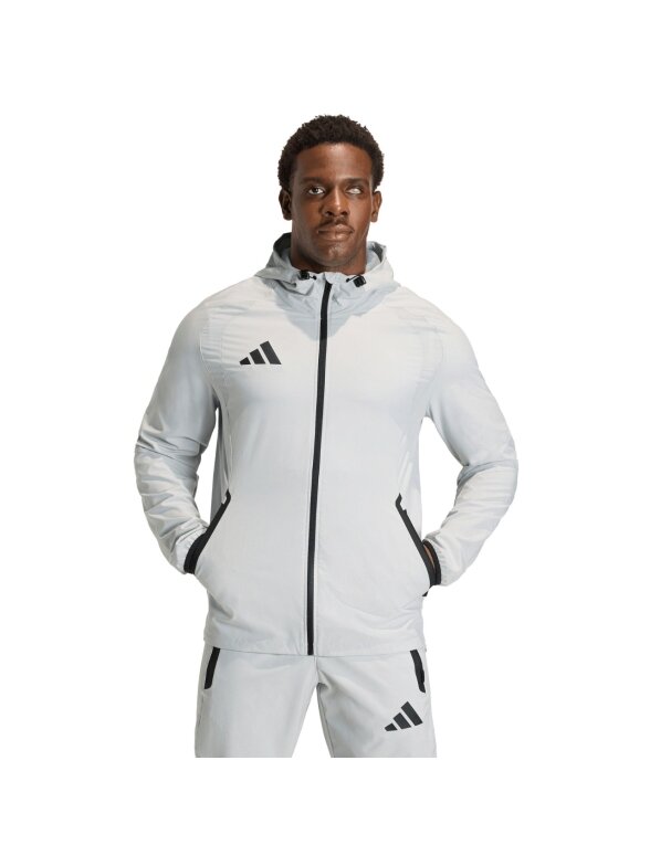adidas Tiro 26 Travel Windbreaker vyriška striukė šviesiai pilka KD3336 adidas Tiro 26 Travel Windbreaker vyriška striukė šviesiai pilka KD3336